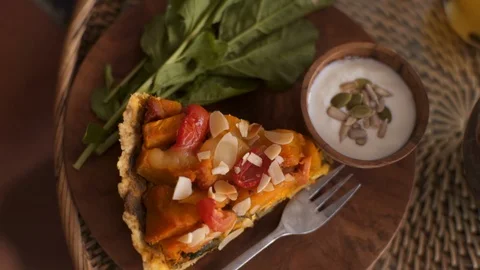 Close up Pumpkin vegetable pie with vegan sauce on a rustic plate. Video stock 101648877