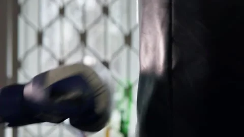 Close-up of a punch on a punching bag. Video stock 302983074
