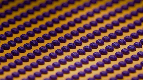 Close-up of purple 3D brain models arranged in repeating pattern on yellow .. Stock Photos