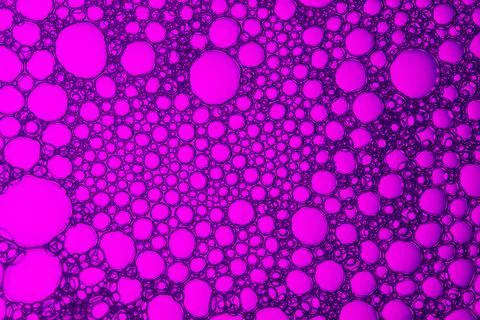 A close up of a purple background with many small circles Stock Photos