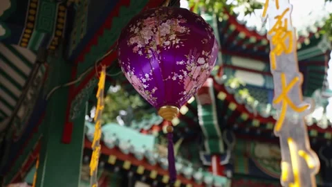 Close up of purple decorative lantern hanging in traditional Asian China temple Stock Footage 297735845