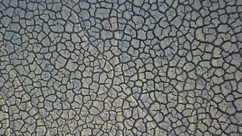 Close Up push Cracks drought soil crisis cross over a dried mud backgrounds Vídeo Stock 334030365
