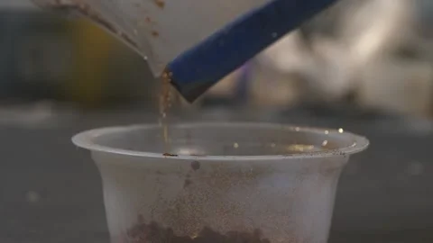 Close up put some glitter in a cup. in an artist's studio. Hobby and art co.. Stock Footage 238937150