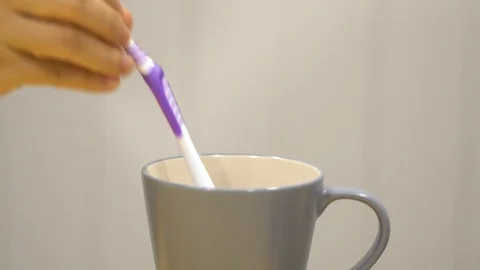 Close up put toothbrush back to the cup family Stock Footage 111151719