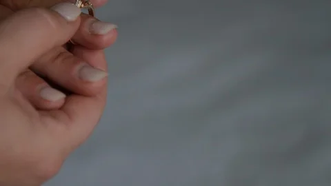 Close up putting engagement ring on Stock Footage 107951730