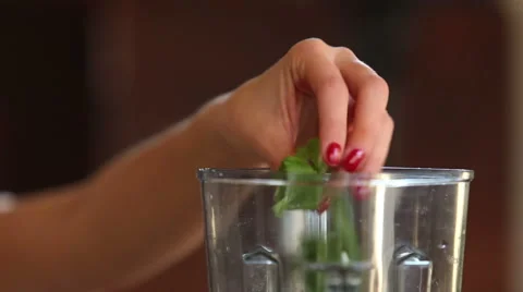 Close-up of putting spinach and cherry tomatoes into blender Stock Footage 59541595