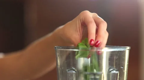 Close-up of putting spinach and cherry tomatoes into blender Stock Footage 59541597