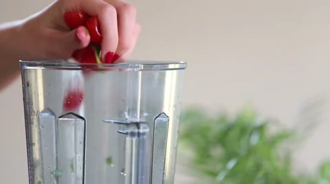 Close-up of putting vegetables and pouring water into blender Video stock 59541600