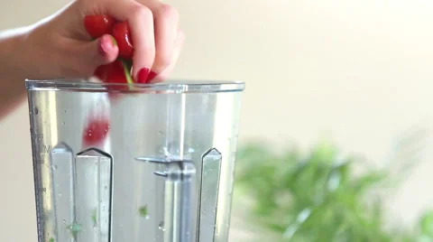 Close-up of putting vegetables and pouring water into blender Stock Footage 59541604