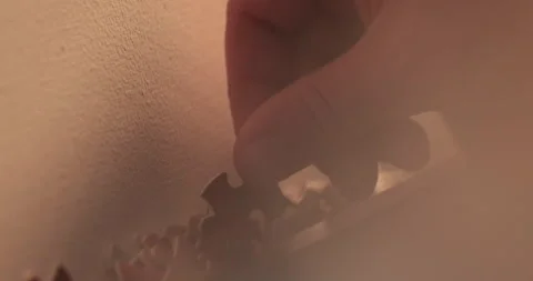 Close-up of the puzzle. A hand that puts a part of the puzzle. Видео 240137816