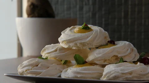 Close-up of a pyramid built of large swirled meringues 스톡 동영상 168183202