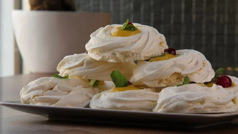 Close-up of a pyramid built of large swirled meringues 스톡 동영상 168183388