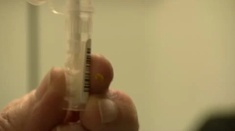 Close on Q-tip in small vial tube Stock Footage 20447814