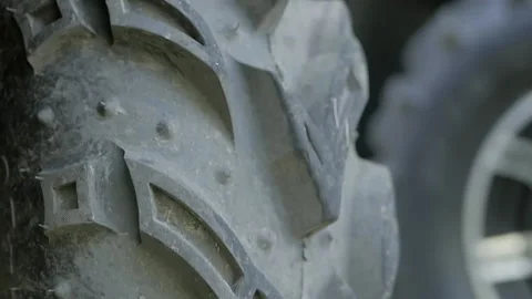 Close up of a Quad bike's wheel protector smeared in dried mud Stock Footage 137787021