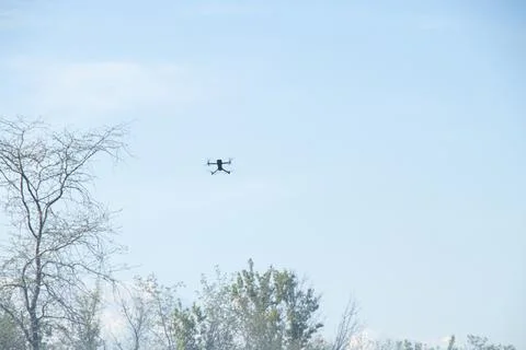 A close-up of a quadcopter in flight in the sky for topics on aerial photog.. Stock Photos