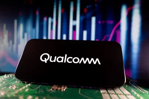 Close up of Qualcomm logo on smartphone screen with financial chart background. Stock Photos
