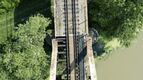 Close quarter flight over an old railway bridge 動画素材 133151606