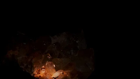 Close up of quartz crystals in a vug, or cave with over head lighting Abstract Stock Footage 128553113