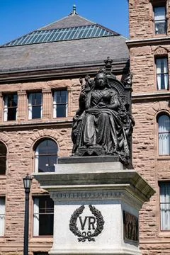Close up of Queen Victoria statue in front of historic building. Toronto, Canada Stock Photos