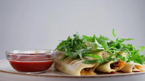 Close-up of quesadilla with arugula and sauce Valentina. Traditional Mexican Stock Footage 306603088