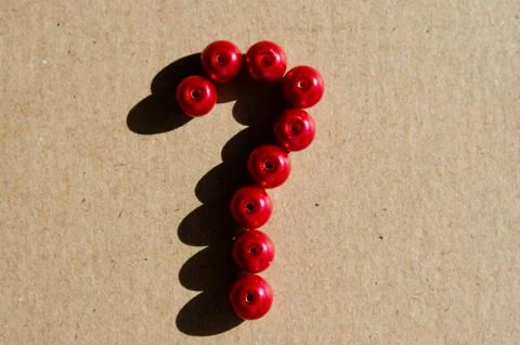 Close-up of   question mark  sign made of red plastic balls. Concept on unans Stock Photos