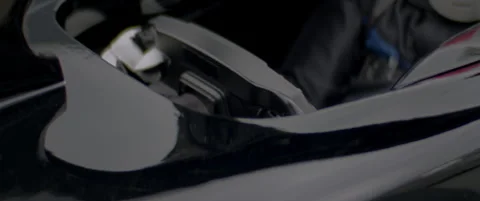 Close-up of a race car driver in a driving fast on a racing track, evening race Stock Footage 318946206