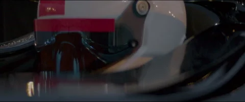 Close-up of a race car driver in a driving fast on a racing track, evening race Stock Footage 319500914