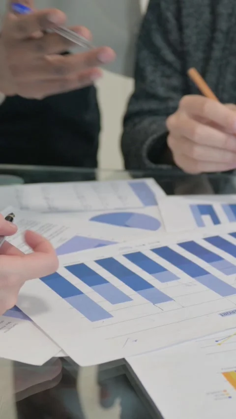 Close Up of Race Entrepreneurs Discussing Documents, vertical video Stock Footage 324788534