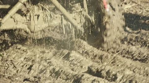 A close-up of a racing SUV. Dirty, spinning wheels and suspension kicking Stock Footage 344876062