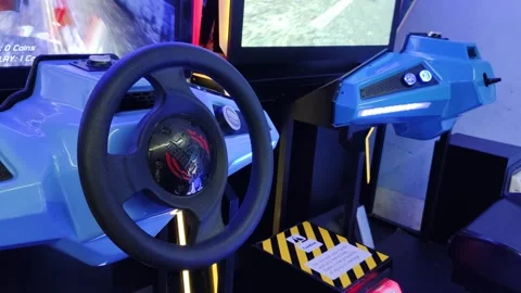 Close-Up of Racing Video Game Arcade Machine Controls and Screen Stock Footage 309840801