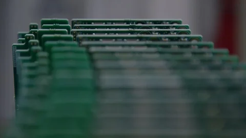 Close up rack focus across circuit boards in factory Stock Footage 89667638