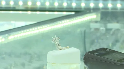 Close Up Rack Focus To Diamond Ring On Display Holder Stock Footage 345502216