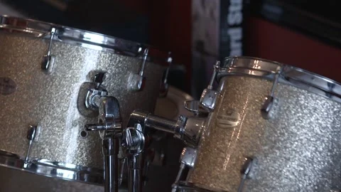 Close up rack focus on drums in a shop Stock Footage 255297637