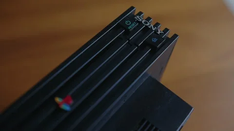Close Up Rack Focus of a Sony Playstation 2 Video Game System Stock Footage 161206580