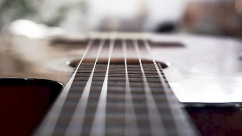 Close-up rack focus on a Spanish guitar Stock Footage 135269296