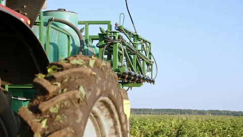 Close up rack focus system for spraying with chemicals and pesticides fields Stock Footage 222851266