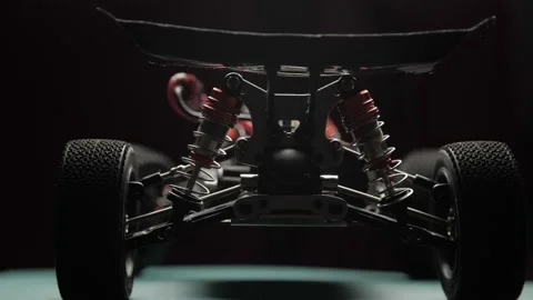 Close-up radio control model buggy car without shell rotating on cutting mat 스톡 동영상 147404650