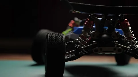 Close-up radio control model buggy car on cutting mat, rear view Video stock 147405126