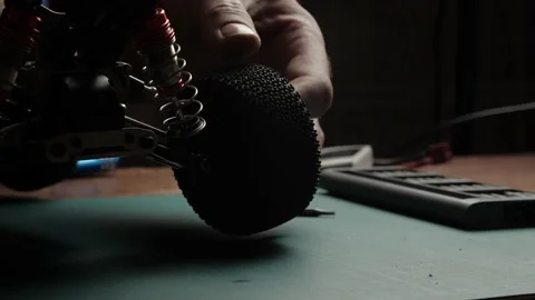 Close-up radio control model buggy car. The hands of the master mounting the Stock-Footage 147405508