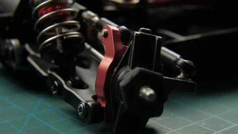 Close-up of radio control model suspension elements buggy car on cutting mat Vídeos de archivo 147404681