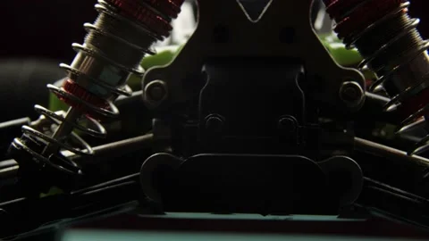 Close-up of radio control model suspension elements buggy car on cutting mat Vídeos de archivo 147404810