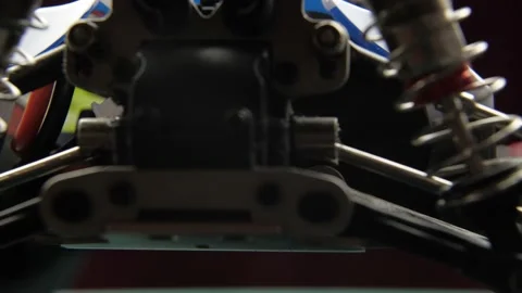 Close-up of radio control model suspension elements buggy car on cutting mat Vídeos de archivo 147404844