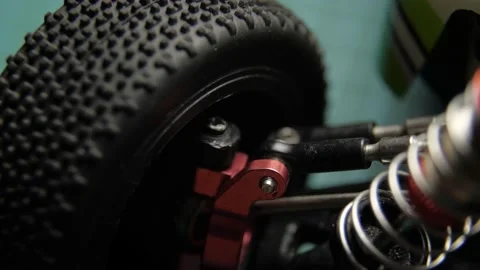 Close-up of radio control model suspension elements buggy car on cutting mat Vídeos de archivo 147404878