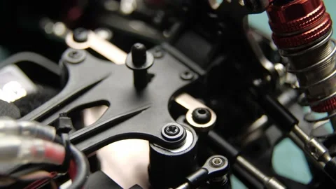 Close-up of radio control model suspension elements buggy car on cutting mat Vídeos de archivo 147404985