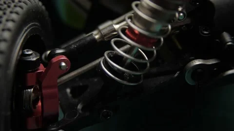 Close-up of radio control model suspension elements buggy car on cutting mat Vídeos de archivo 147405283