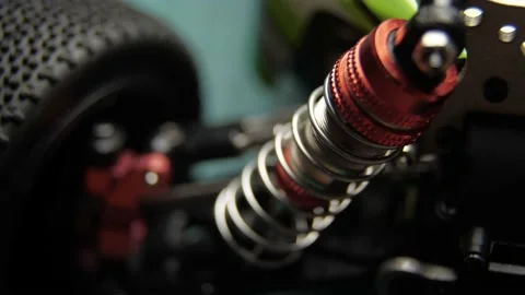 Close-up of radio control model suspension elements buggy car on cutting mat Vídeos de archivo 147405366