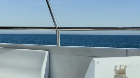 Close-up of railings and seats on the upper deck of a boat swaying on the w.. Stock Footage 300217177