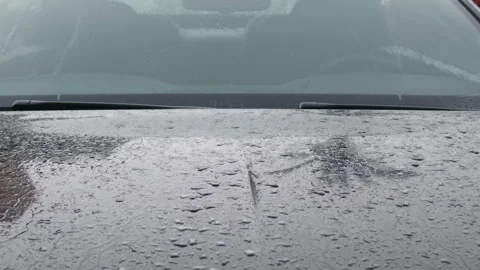 Close-up of rain on a car hood beneath the windshield and wipers, Cote d'Azur, Stock Footage 344818939