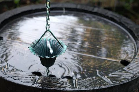 Close-up of a rain chain cup Stock Photos