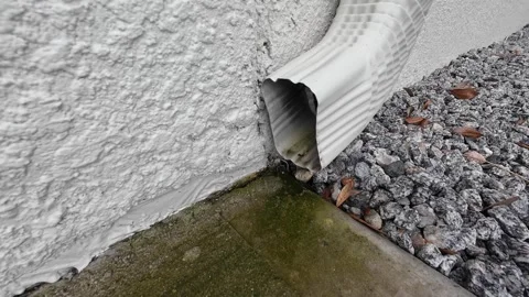 Close Up Rain Drainage Gutter With Rainwater Dripping Out, 4K Video stock 248475848